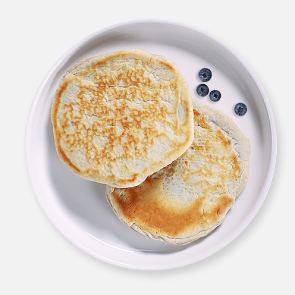 2 blueberry pancakes on a plate