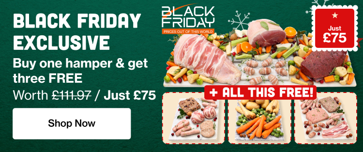 A large Christmas turkey wrapped in bacon with 3 small chopping boards containing free items