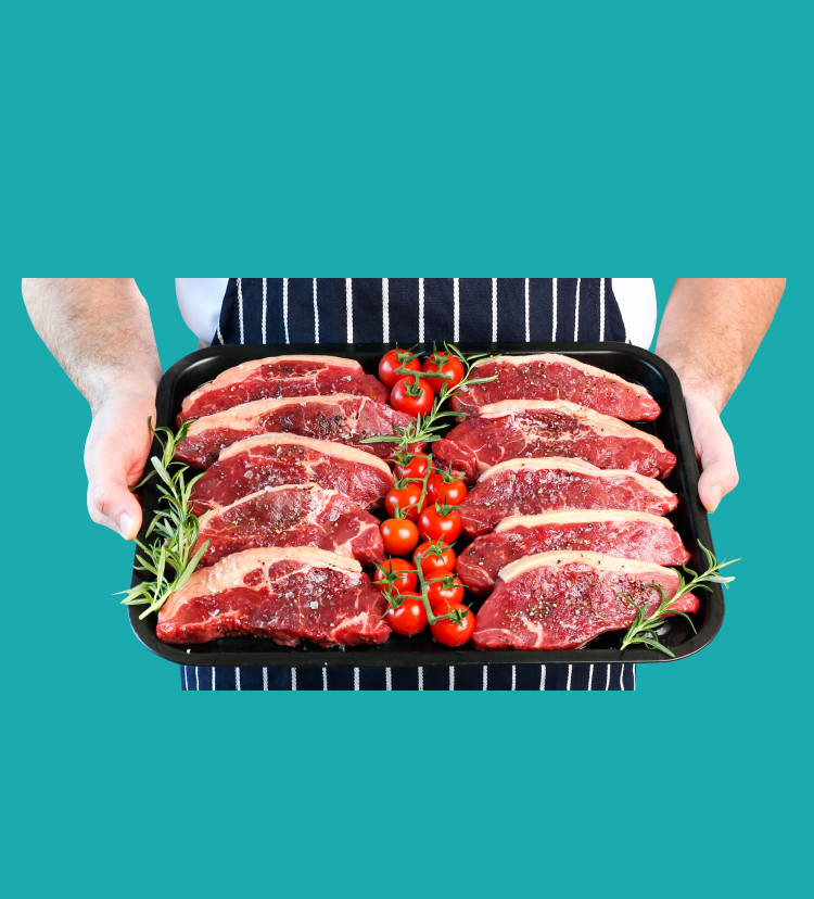 10 x Angus Sirloin Steaks arranged on a baking tray held by a butcher