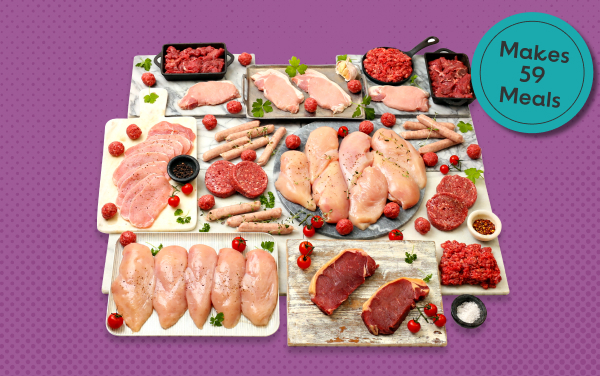 Various raw meats arranged on trays and boards - makes 59 meals
