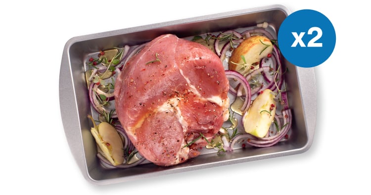 Gammon joint in a roasting pan with apple and herbs and callout x2