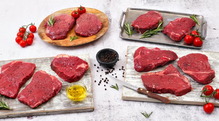 10 Heritage Range rump steaks arranged on a slate board